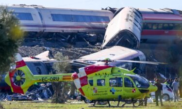 Emergency services work at the scene of a collision between two trains in Urda