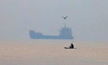 A commercial vessel appears anchored in the Strait of Hormuz off Bandar Abbas