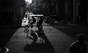 A car drives down a street in Havana on August 4.